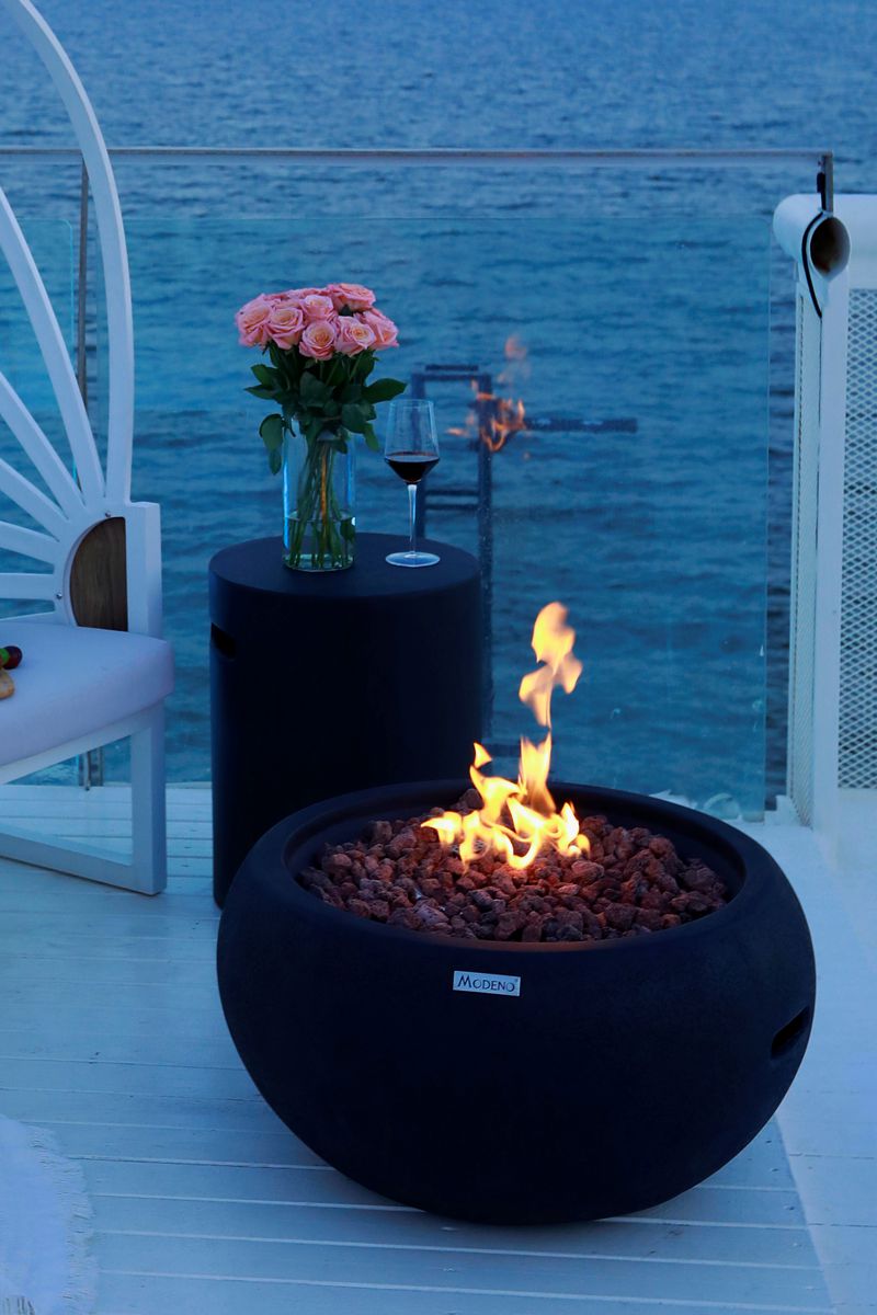 YORK fire bowl on a terrace in the evening