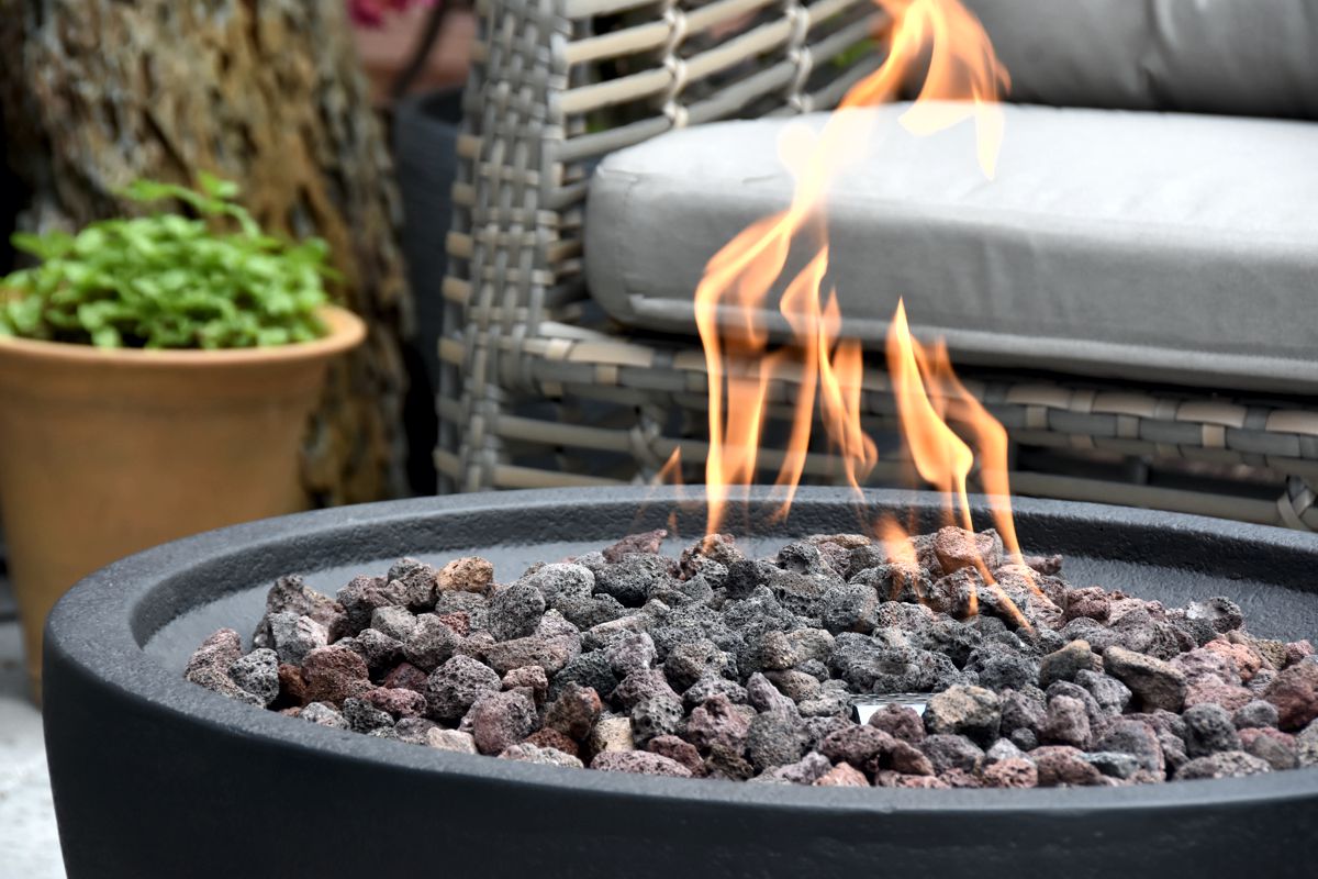 The surface and lava stones of the JEFFERSON fire pit up close