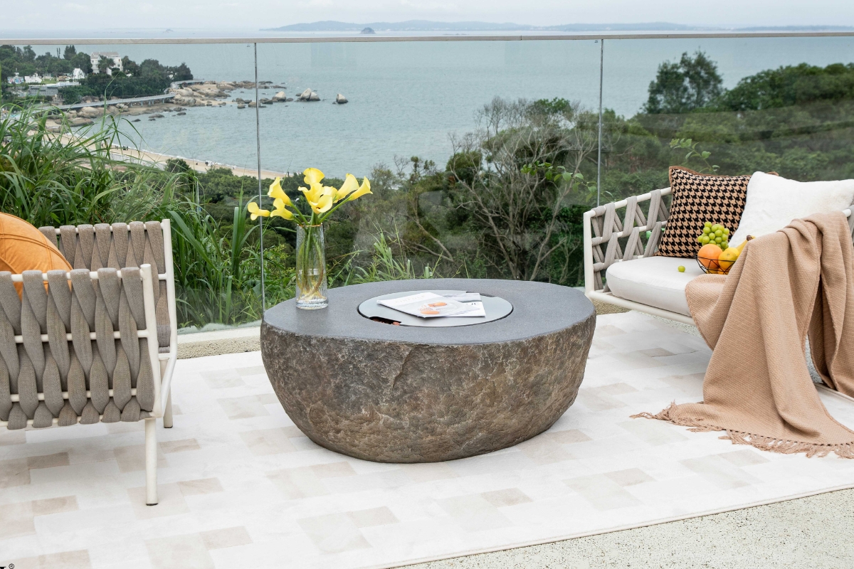 Round stainless steel lid in a fire pit