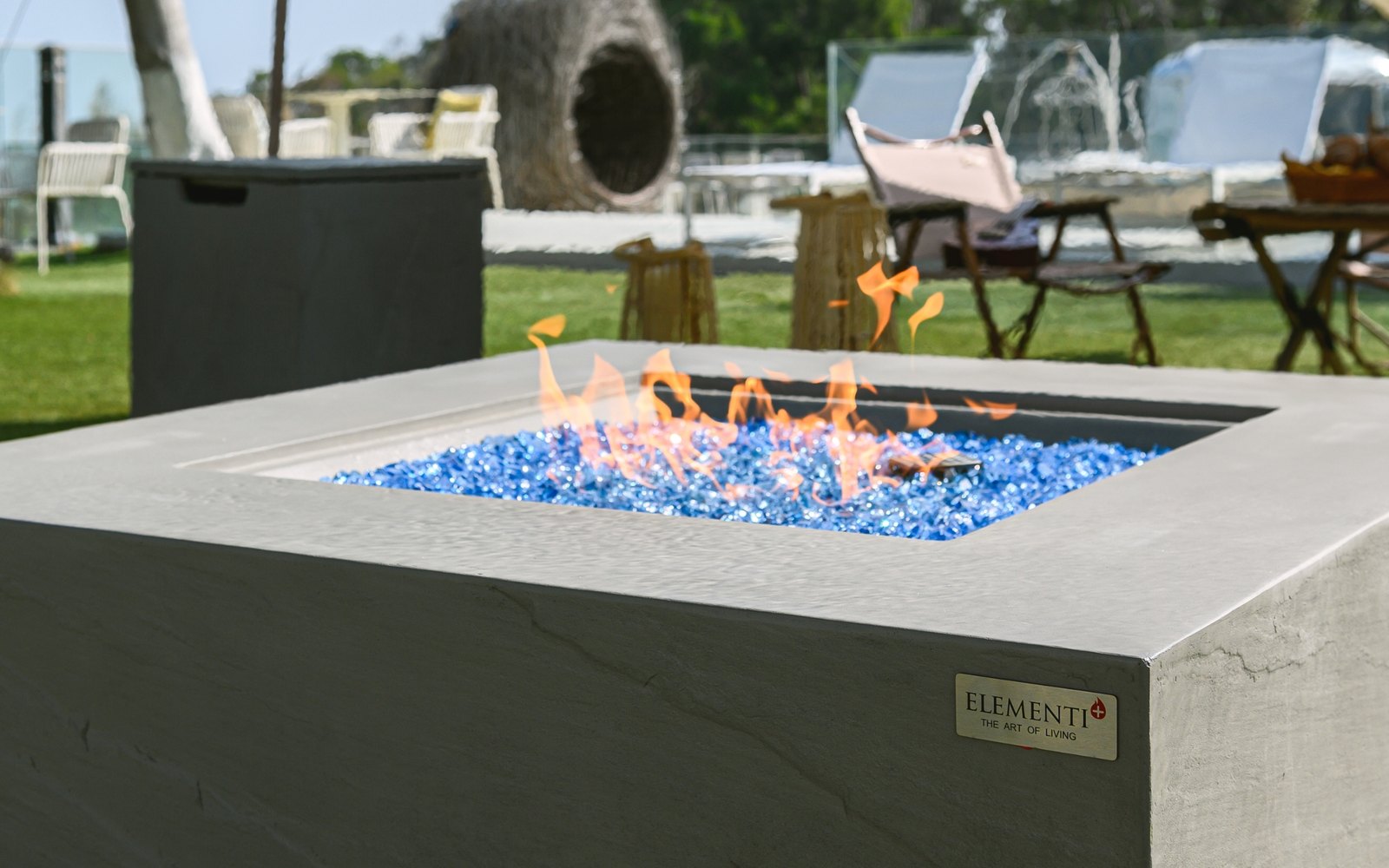 Blue fire glass in a lit fire pit