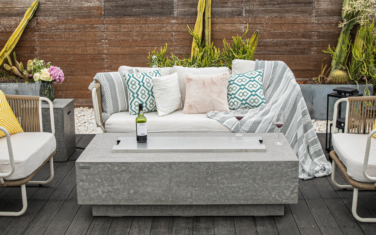 KINGSALE fire pit with the stainless steel lid and a bottle of wine on a terrace