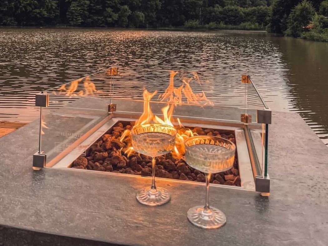 The lit LISMORE fire pit at sunset