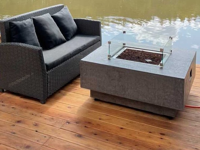 LISMORE table on a wooden deck by a lake