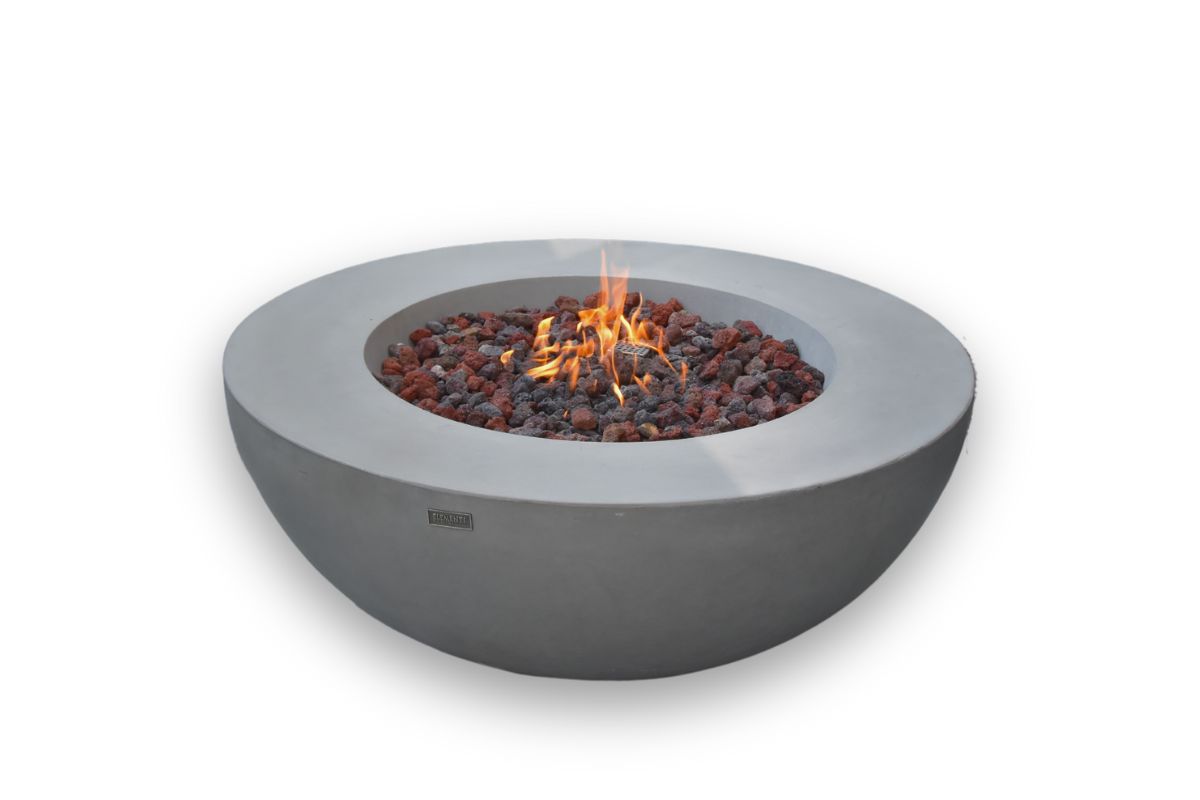 LUNAR BOWL Light Grey round fire pit with a lit fire