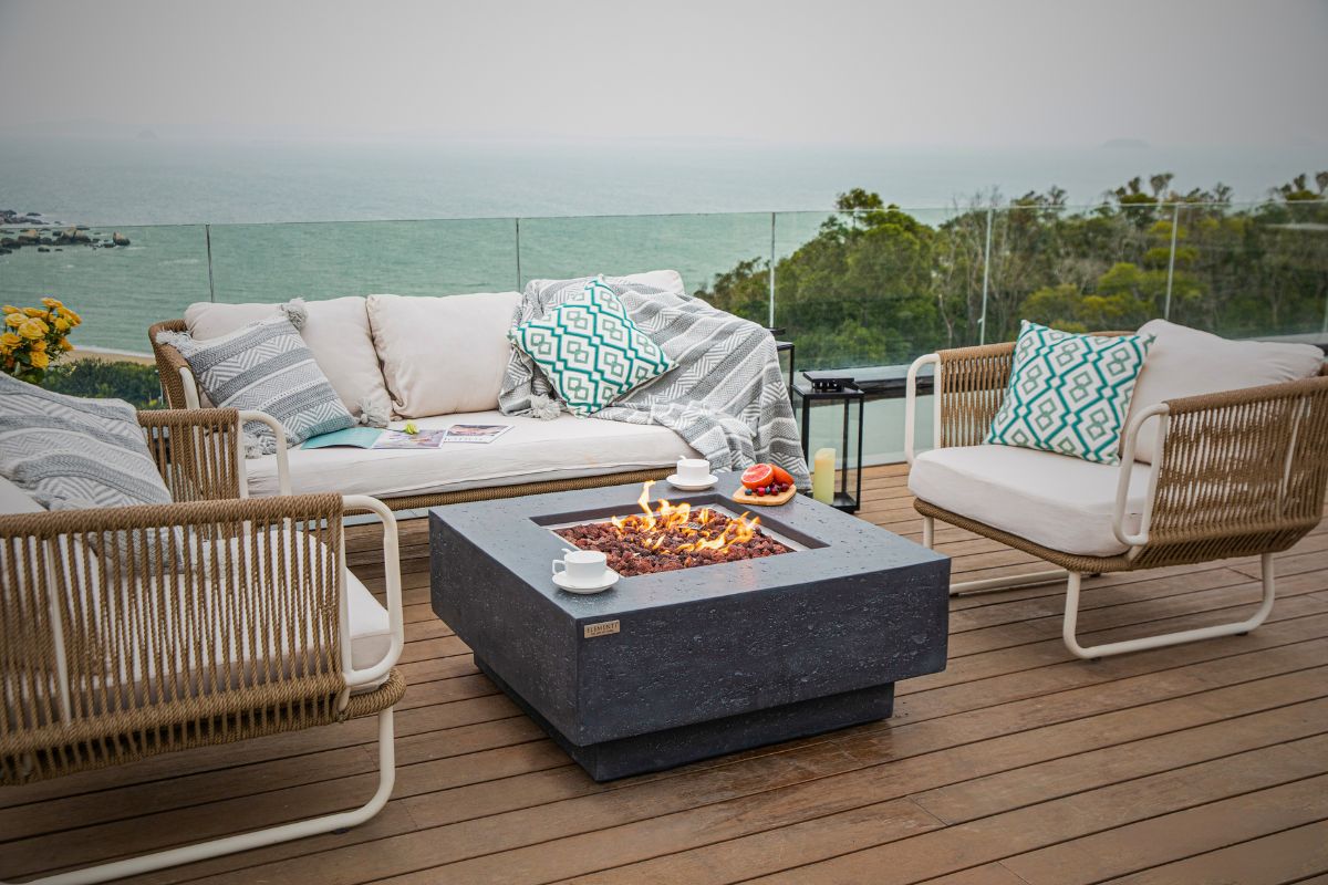 MANHATTAN Dark Grey table on a terrace overlooking the sea