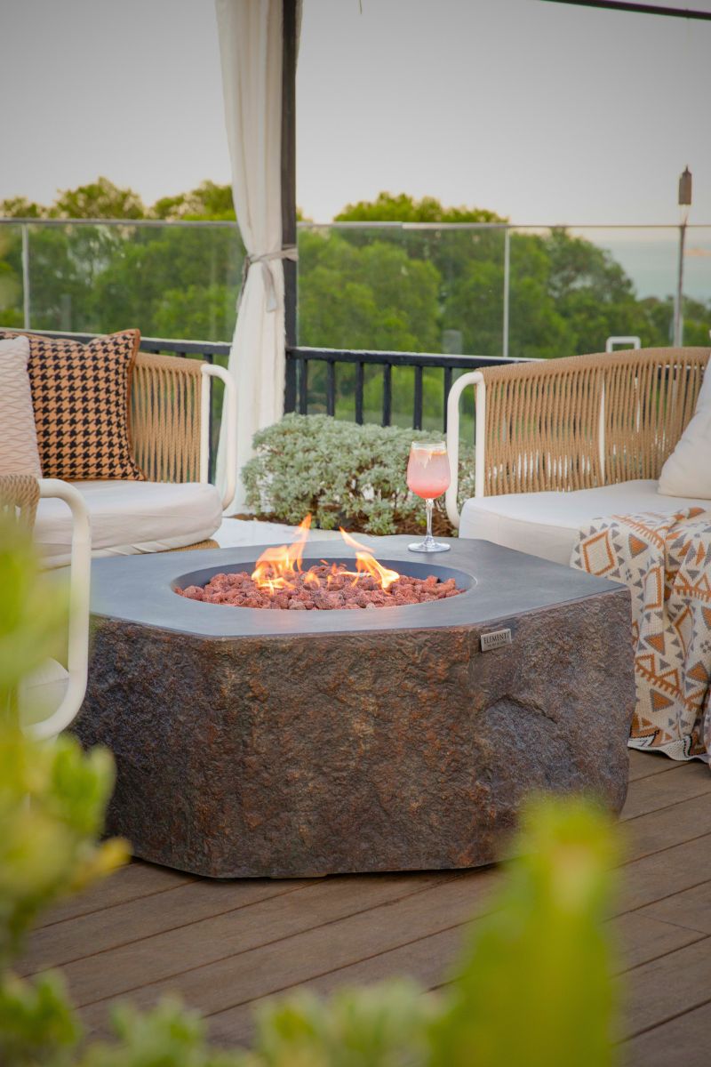COLUMBIA fire pit with lava stones on a terrace