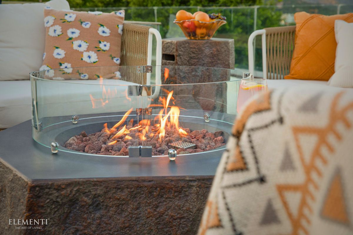 COLUMBIA fire pit with the glass wind guard on a terrace