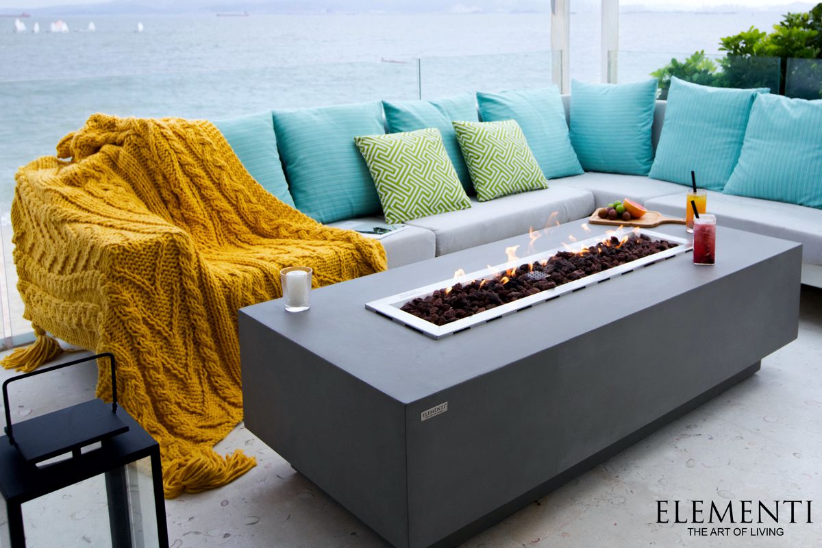 GRANVILLE table with a lit fire pit in front of a sofa