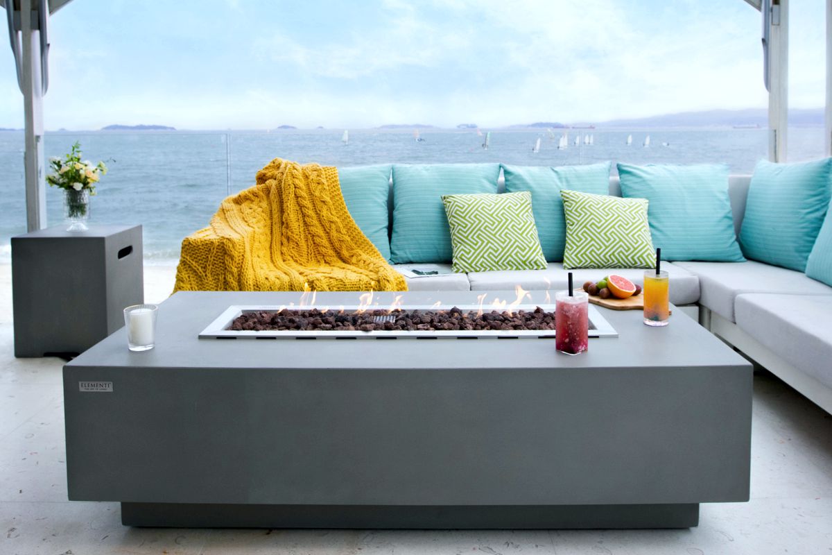 GRANVILLE table with the bottle cover on a seaside terrace
