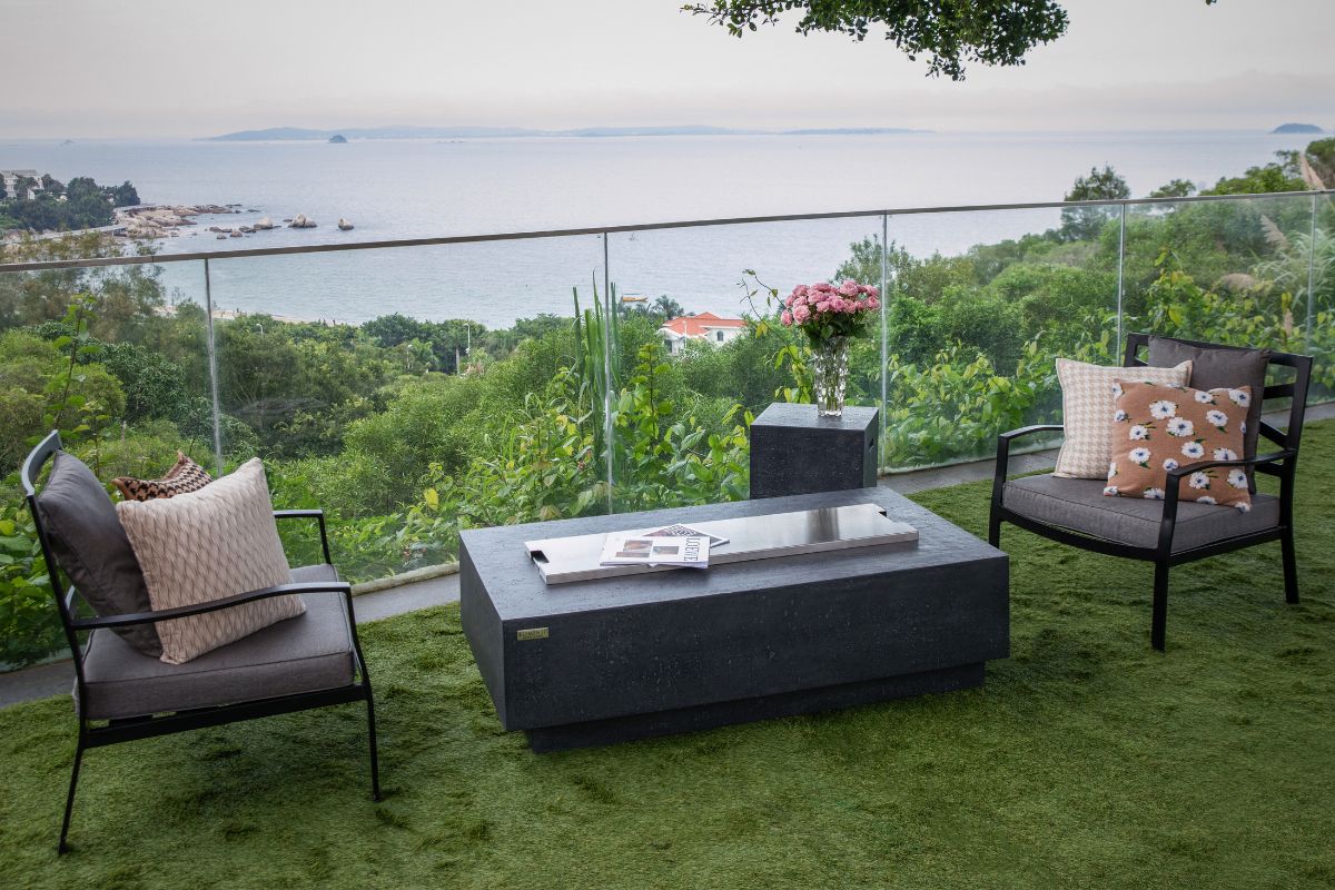 KINGSALE Dark Grey table on a terrace overlooking greenery