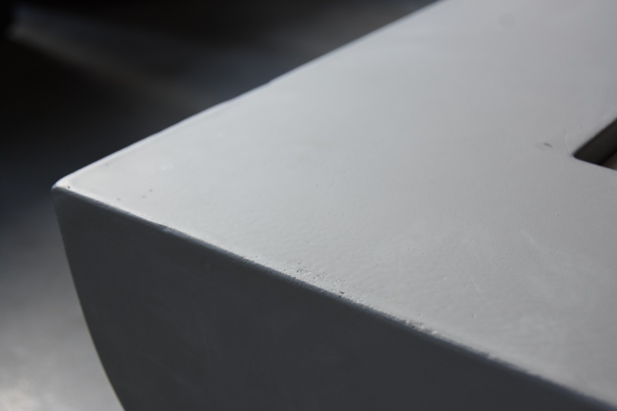 Edge of the smooth concrete WESTPORT table up close