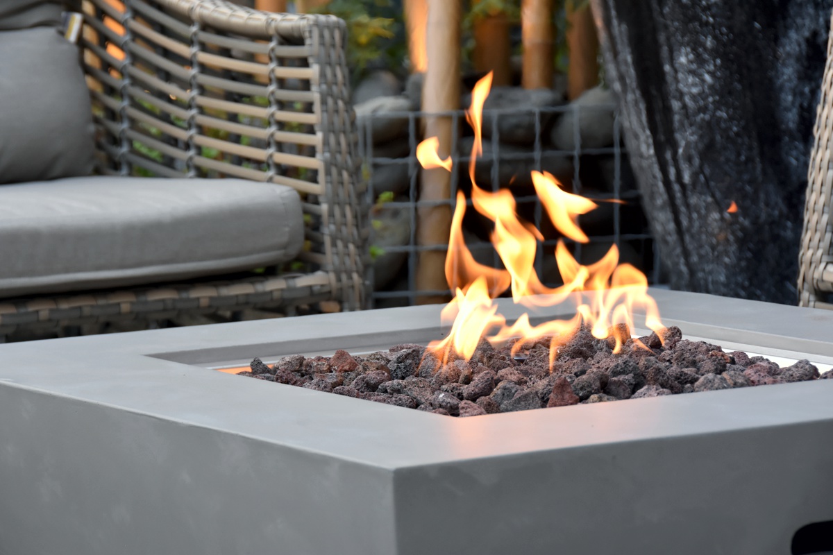 The flame over the lava stones in the WESTPORT fire pit