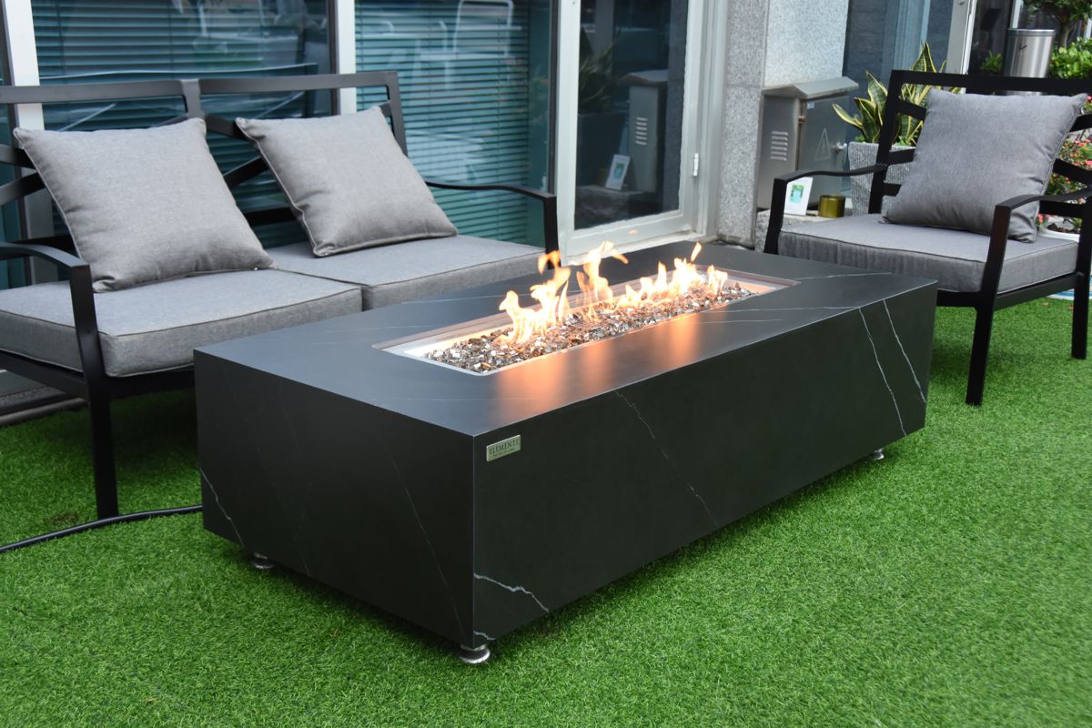 VARNA table with a lit fire on a terrace in front of a sofa