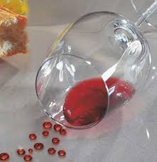 A knocked-over glass of red wine